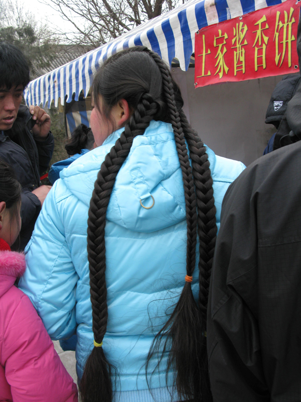 Thick hair made into 3 braids