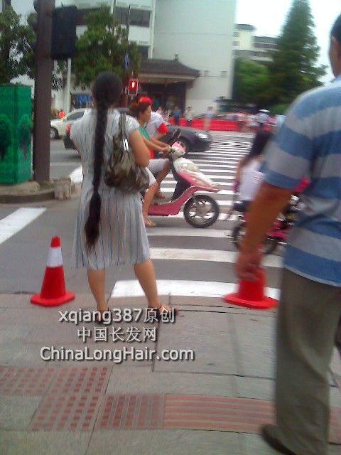 Streetshot of thigh length thick braid