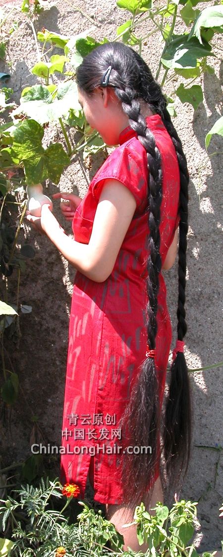 Young girl with knee length thick braid-4