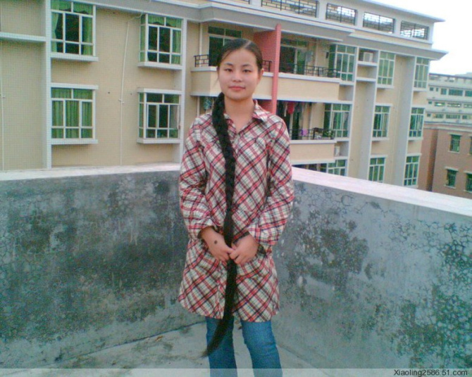 Young girl with long braid on roof