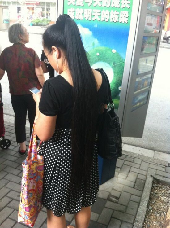 Streetshot of long ponytail on bus station