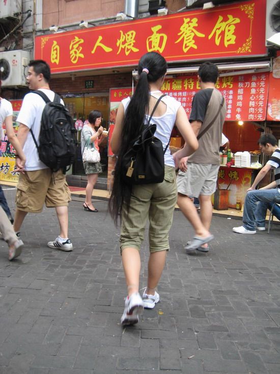 Streetshot of long ponytail on buying food