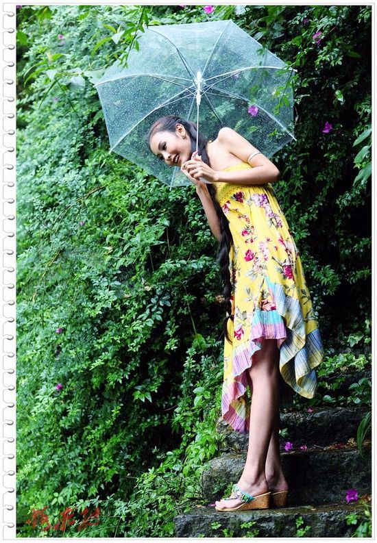 Beautiful young girl show long hair with umbrella