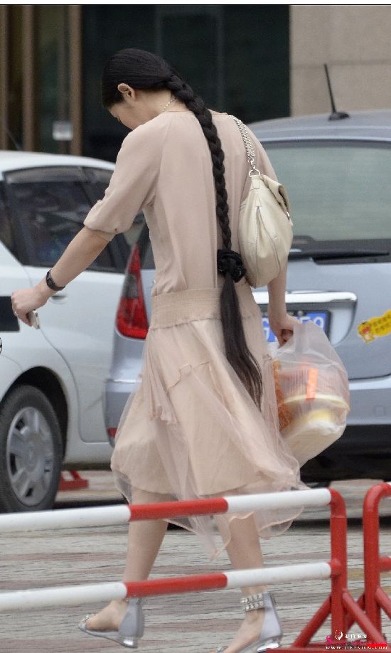 Streetshot of long braid lady