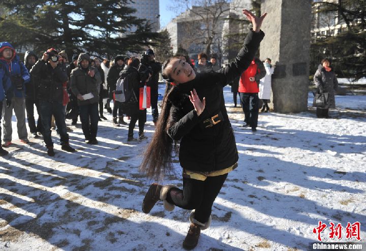 Beautiful long hair girl danced in snow field