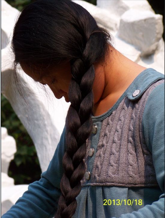 Young lady has thick long hair