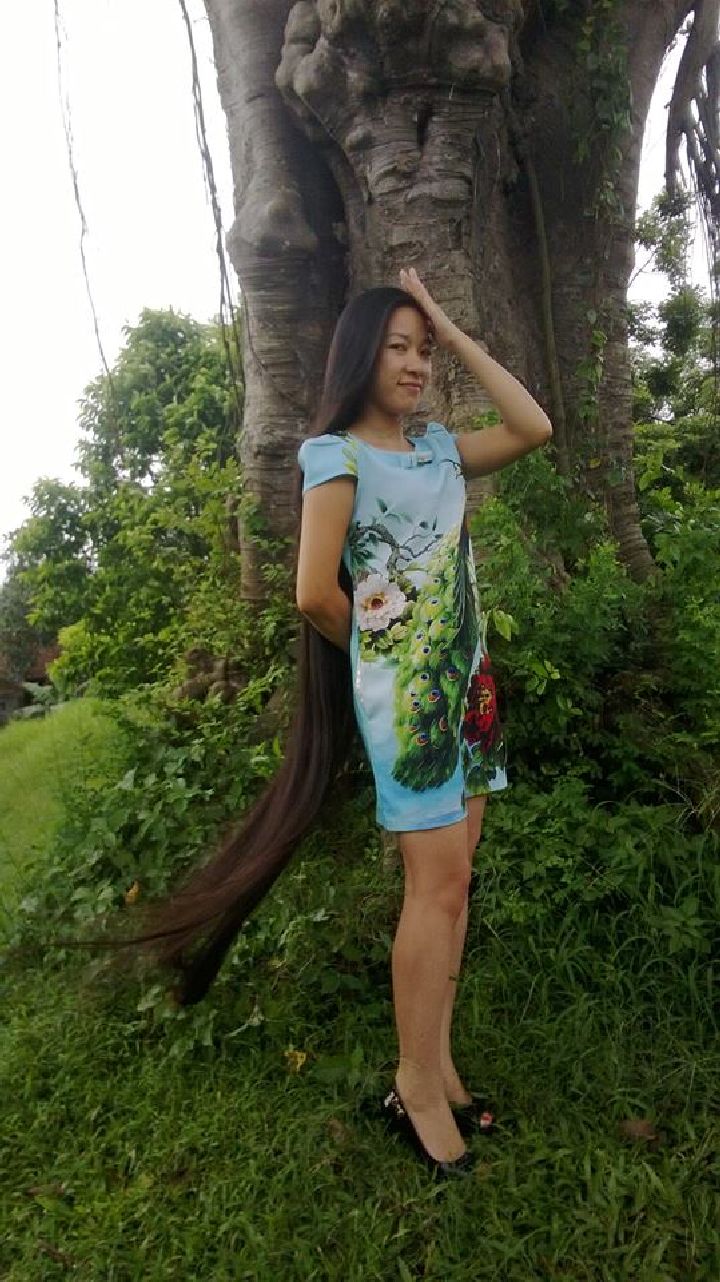 Floor length long hair gilr in countryside