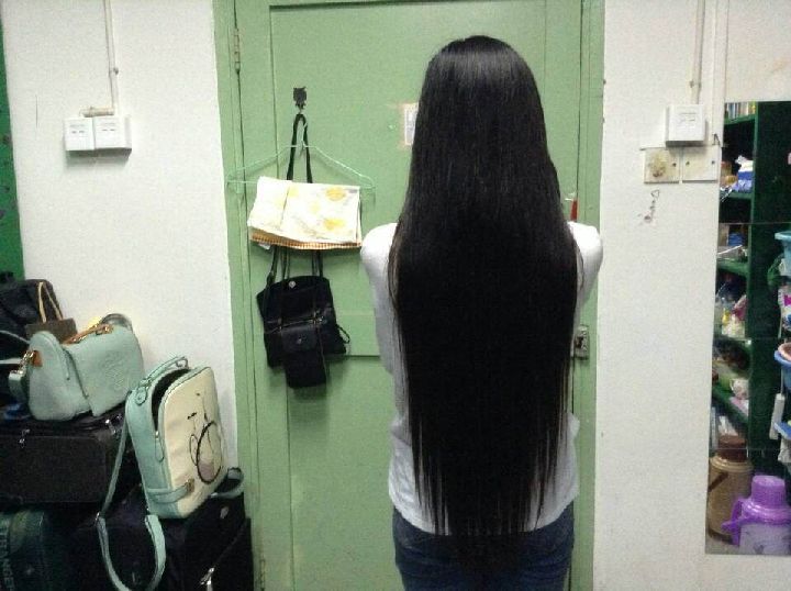 Young girl with thigh length long hair