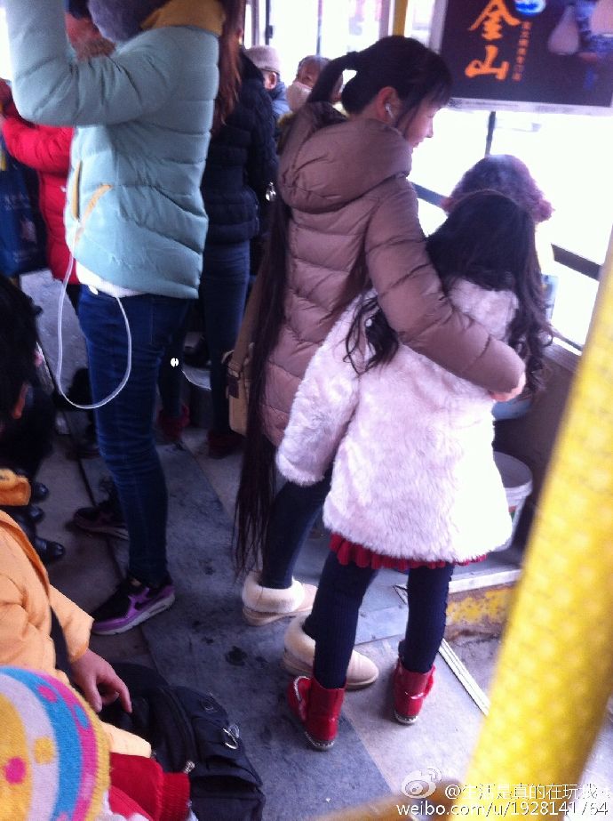 Floor length long ponytail on bus