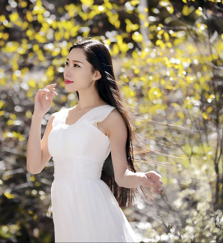 Black long hair girl dressed in white long skirt