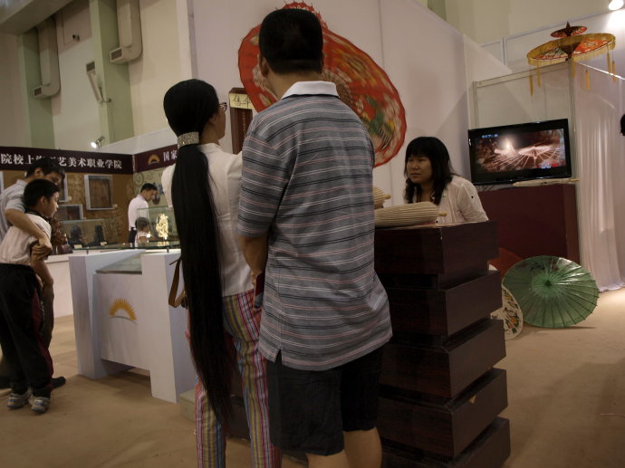 Knee length long ponytail in museum