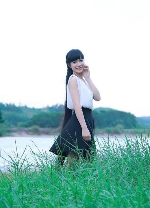 Beautiful young girl took long hair photos near river