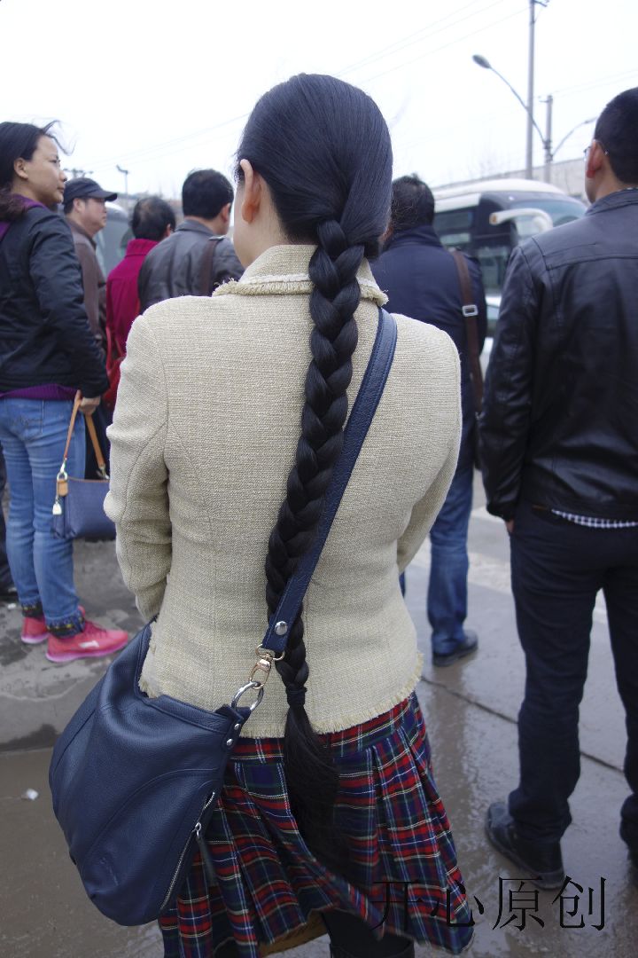 Streetshot of long braid by eflikai