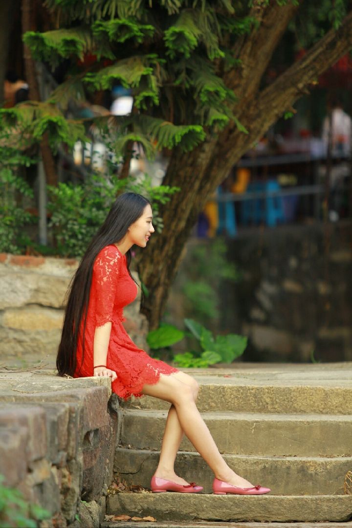 Beautiful long hair girl in red skirt