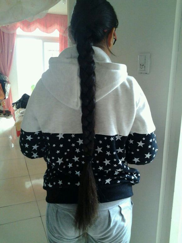 Young girl has hip length long braid