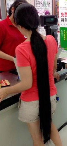 She is not young girl but has super long ponytail