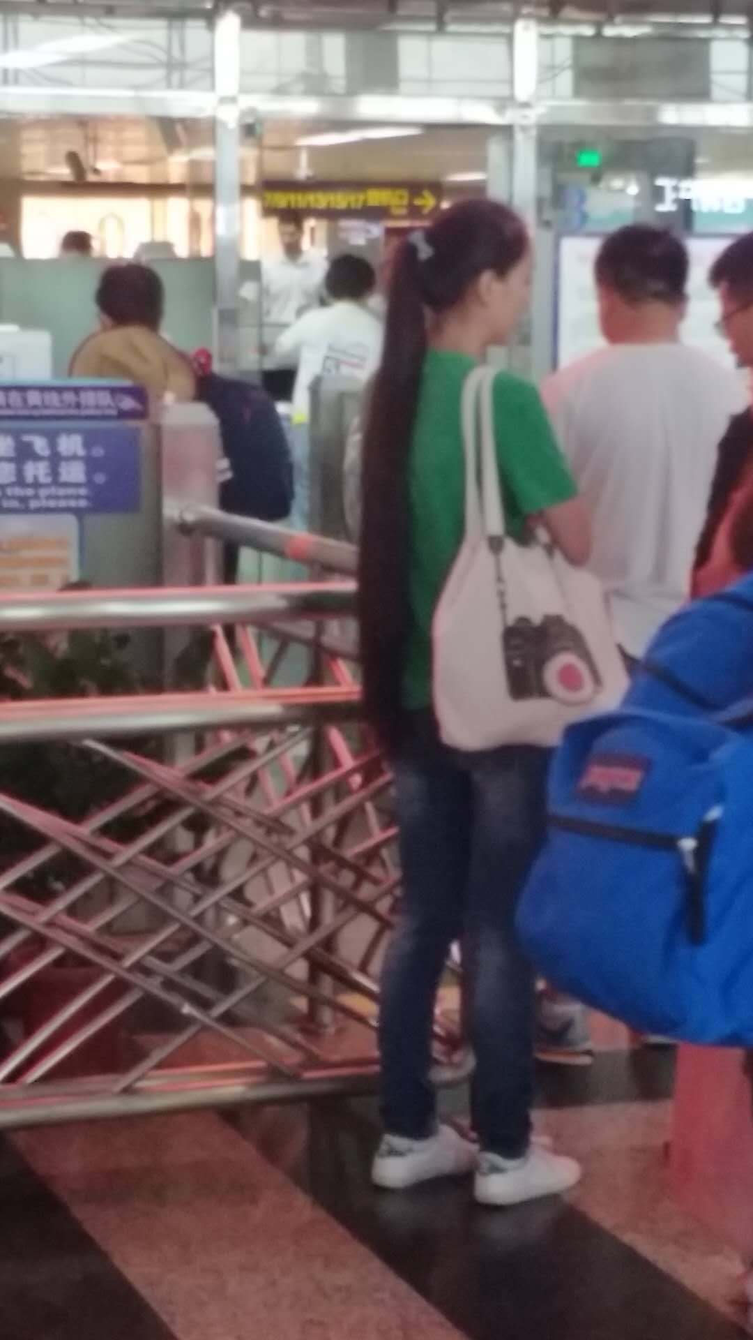 Streetshot of hip length long ponytail